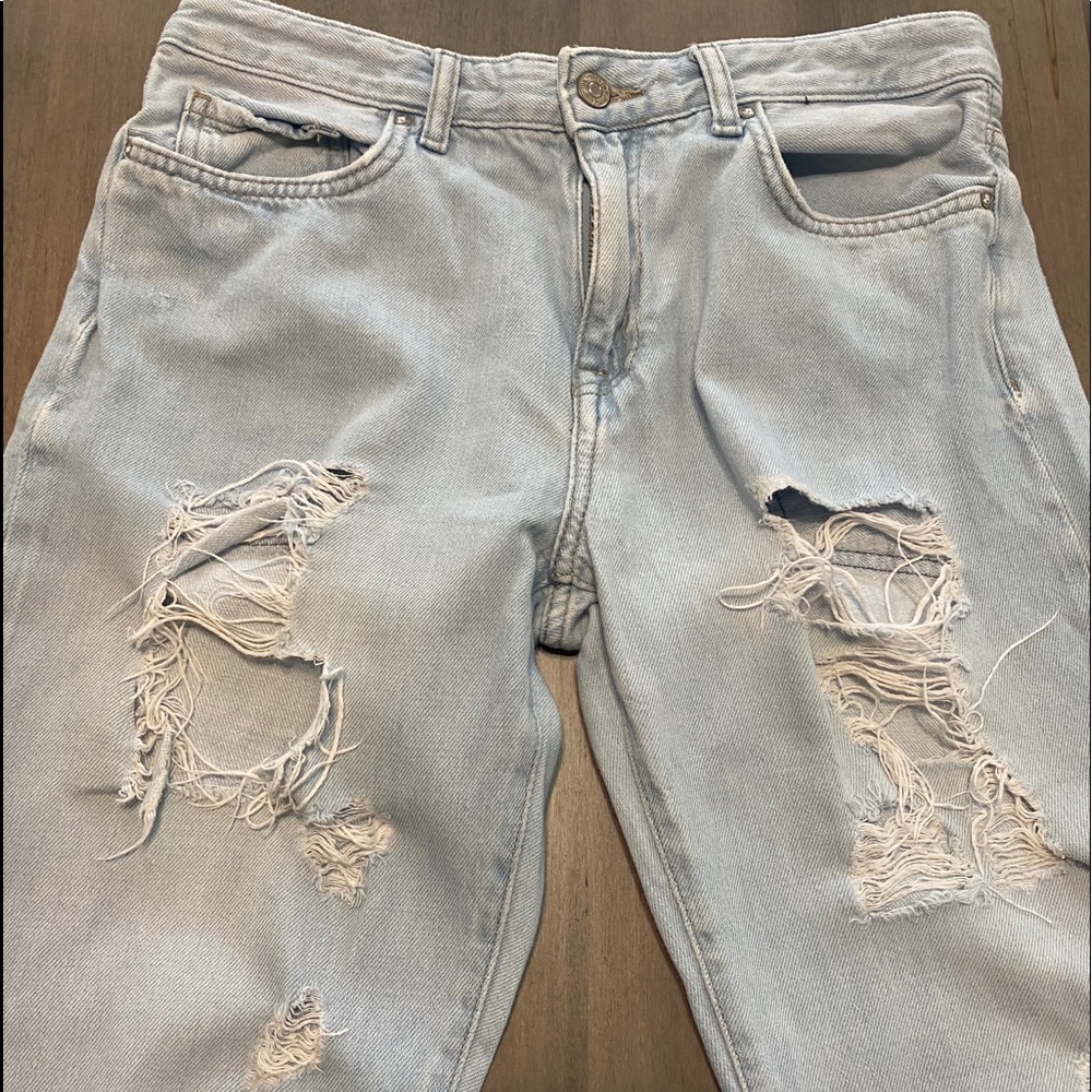light blue baggy ripped jeans